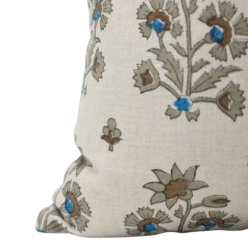 Decorative pillow with floral embroidery on a white background

