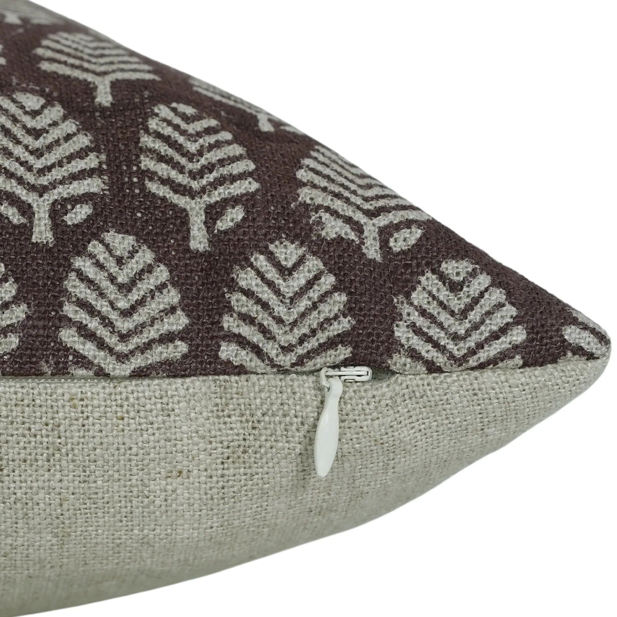 Decorative pillow with geometric pattern on brown background