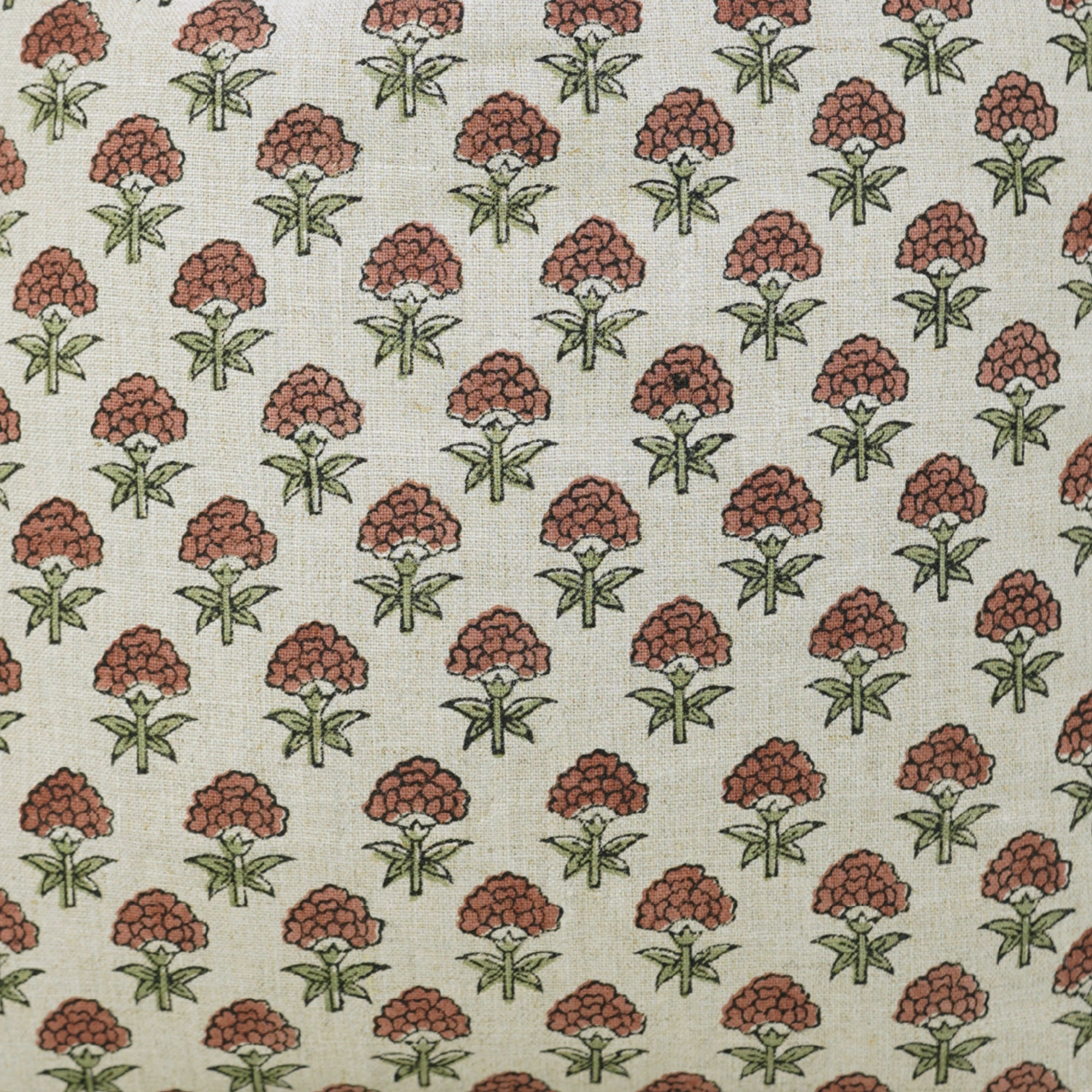 Patterned fabric with red floral design on a beige background