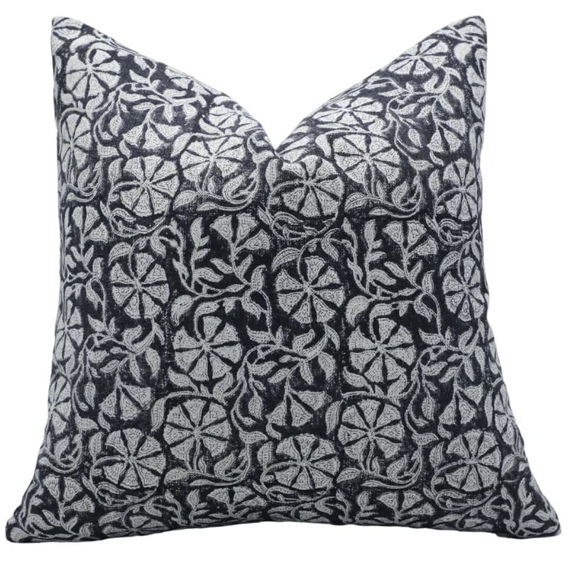 Decorative pillow with black and white floral pattern on a white background

