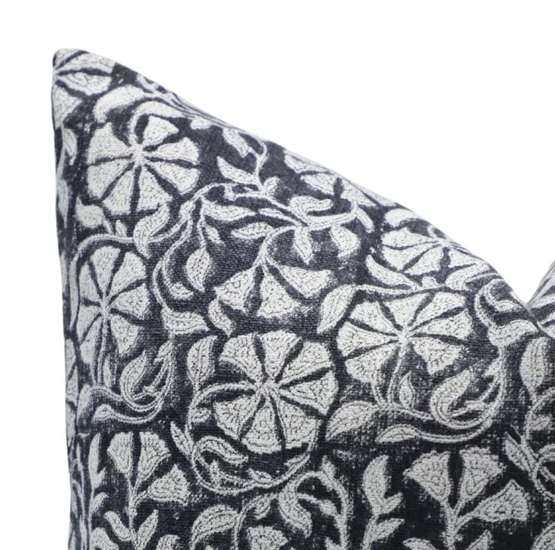 Patterned fabric with black and white design on a white background

