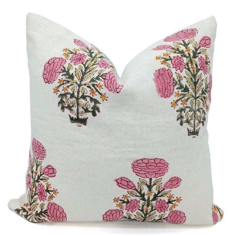 Floral embroidered pillow with pink flowers on a white background