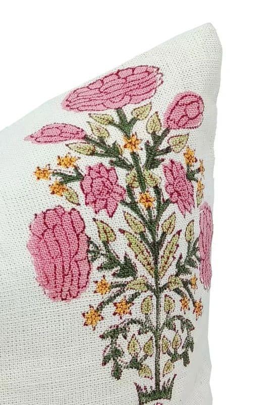 Decorative pillow with floral embroidery on a white background