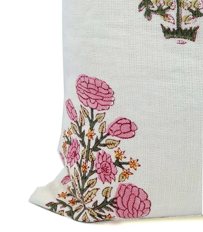 Floral embroidered fabric with pink flowers on a white background