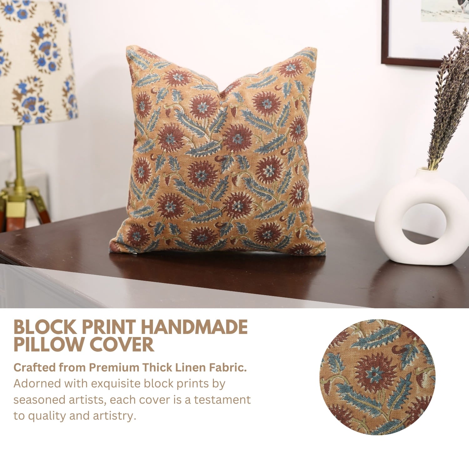 Decorative pillow cover with floral pattern on a wooden surface, surrounded by home decor items.