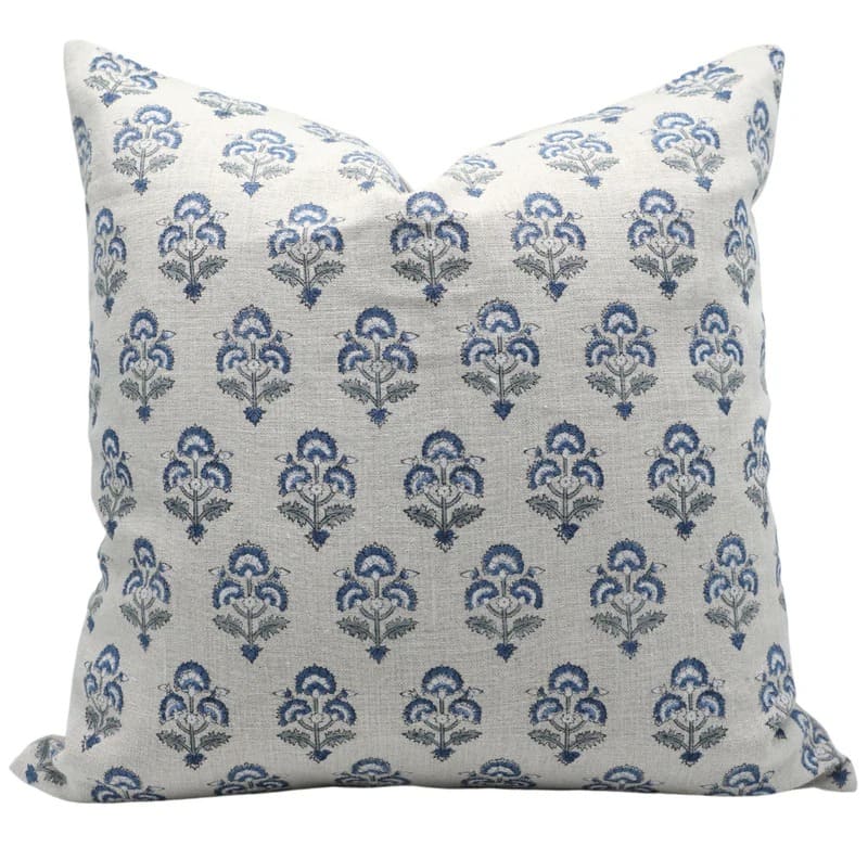 Decorative pillow with blue floral pattern on a white background

