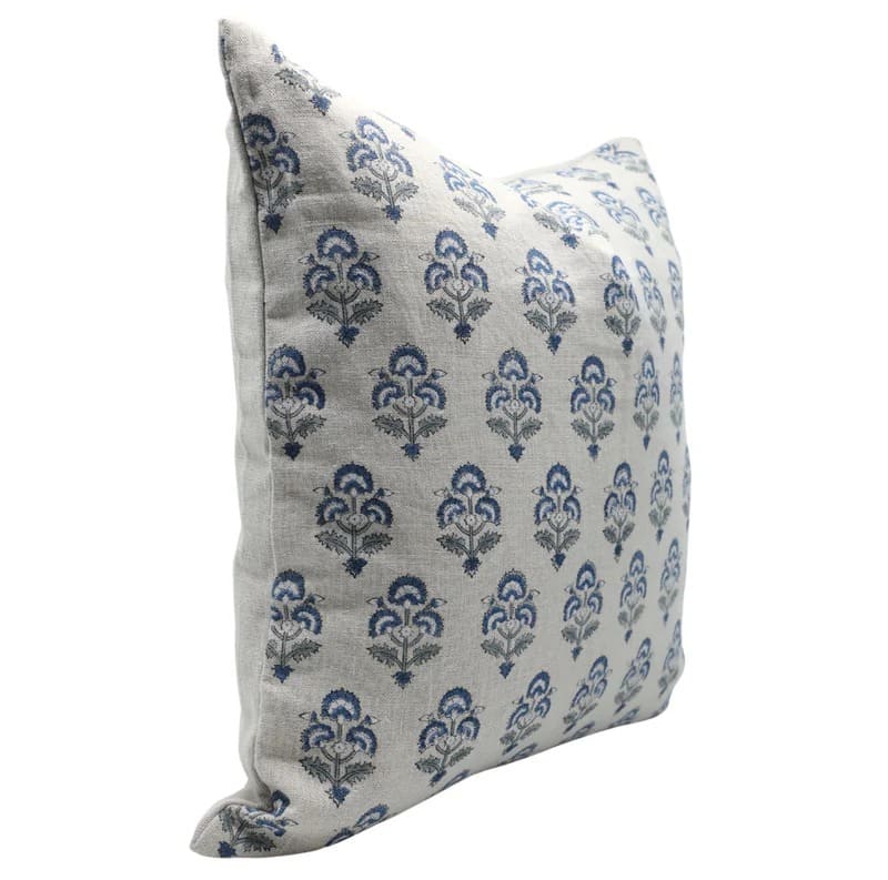 Decorative pillow with blue floral pattern on a white background

