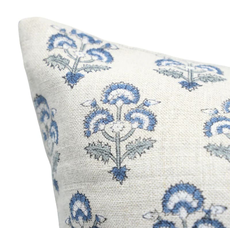 Decorative pillow with blue floral pattern 
