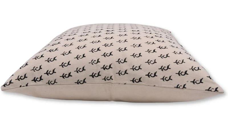 Beige pillow with black anchor pattern pillow