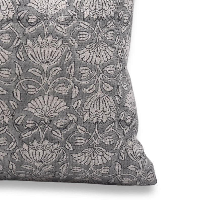 Gray decorative pillow with floral pattern on a white background