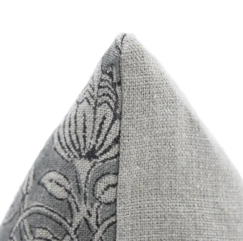 Gray textured pillow with a subtle pattern on a white background