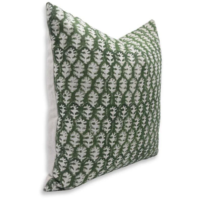 Green and white patterned pillow on a white background
