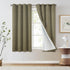 Green curtains with white lining in a room with a lamp and plant.