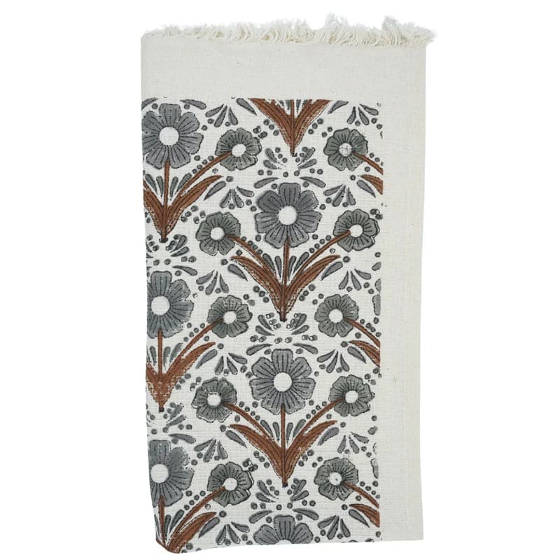 Green patterned tea towel hanging in kitchen