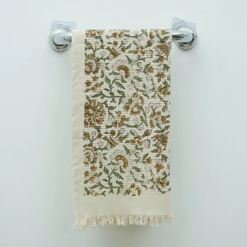 Green decorative hand towel with geometric artwork