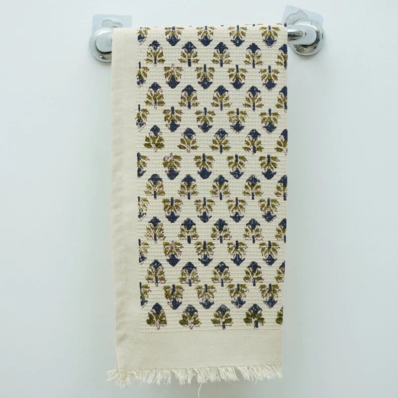 Decorative green hand towel neatly folded