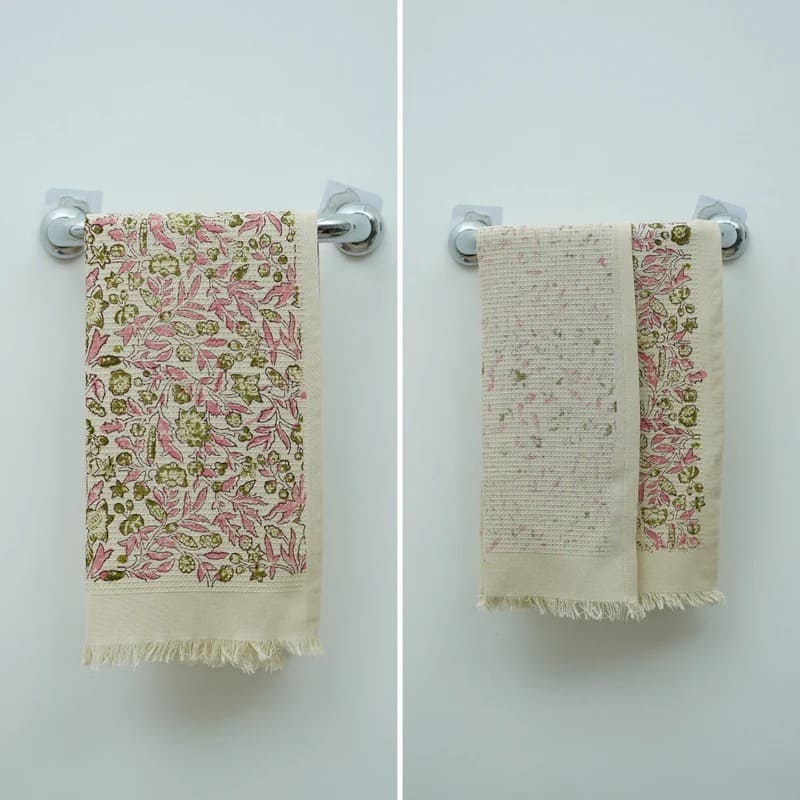 Green patterned towel on sink counter top