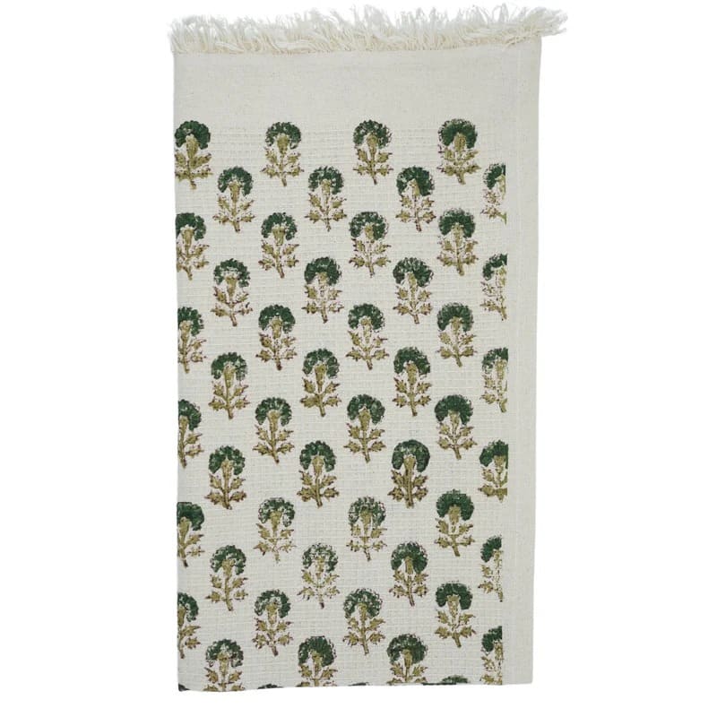 Green hand towel hanging on bathroom hook