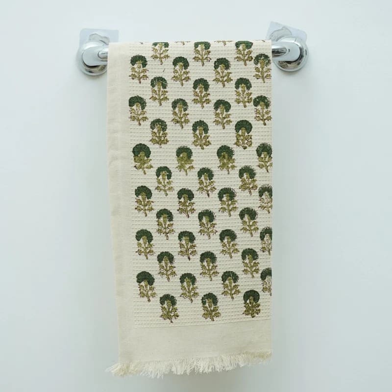 Cotton decorative towel on sink in green