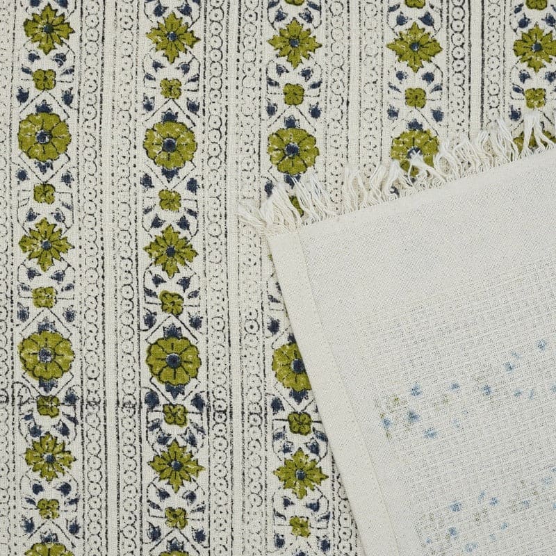 Decorative green hand towel on countertop