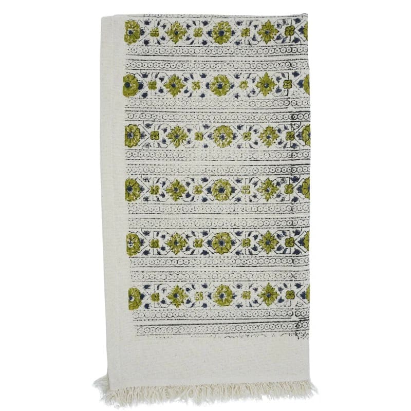 Green patterned towel draped over rack