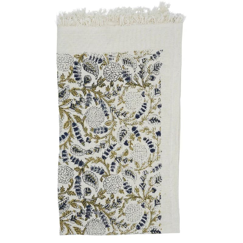 Green decorative towel folded for guests
