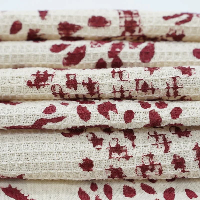 Hand towel green pattern draped on shelf