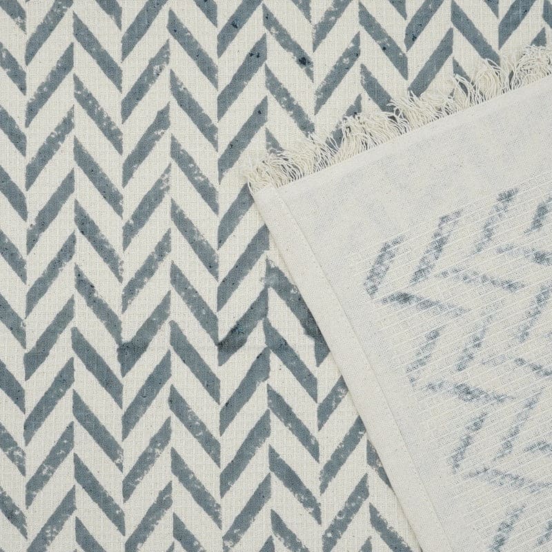 Hand towel green pattern resting on sink