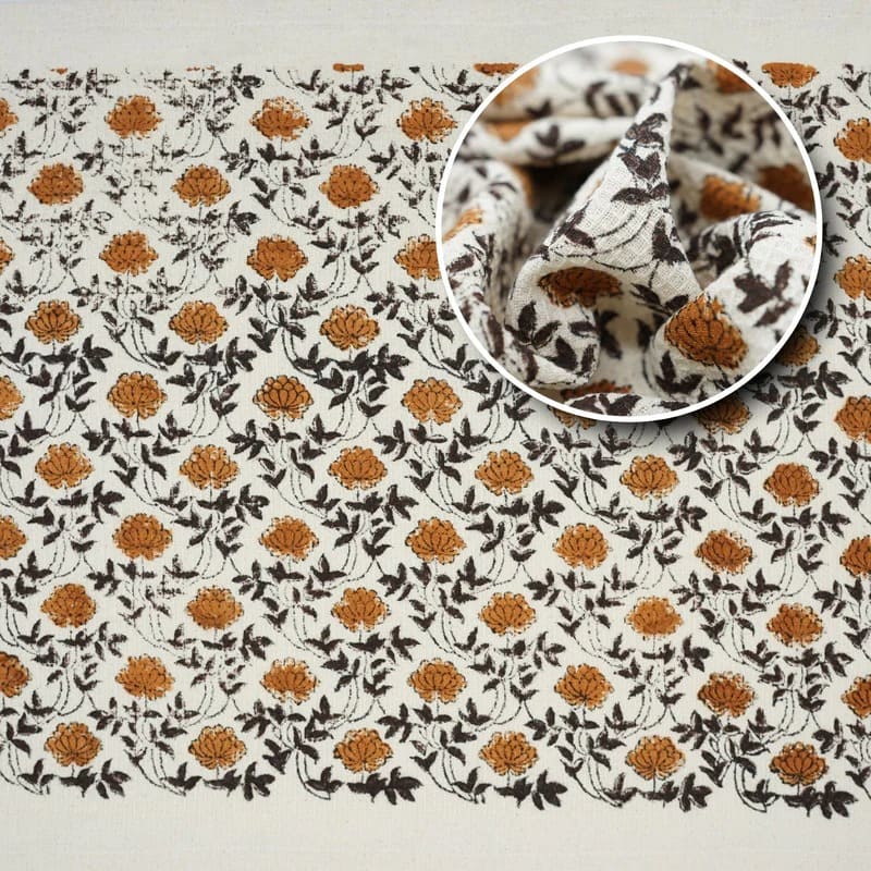 Cotton green towel draped over towel bar