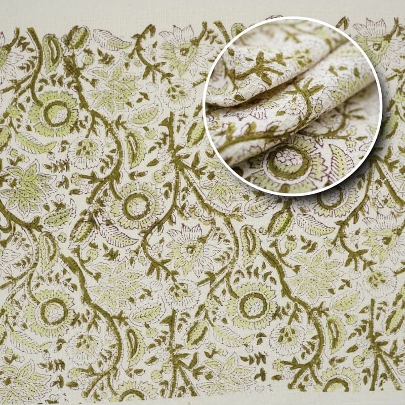 Decorative green hand towel on bathroom tray