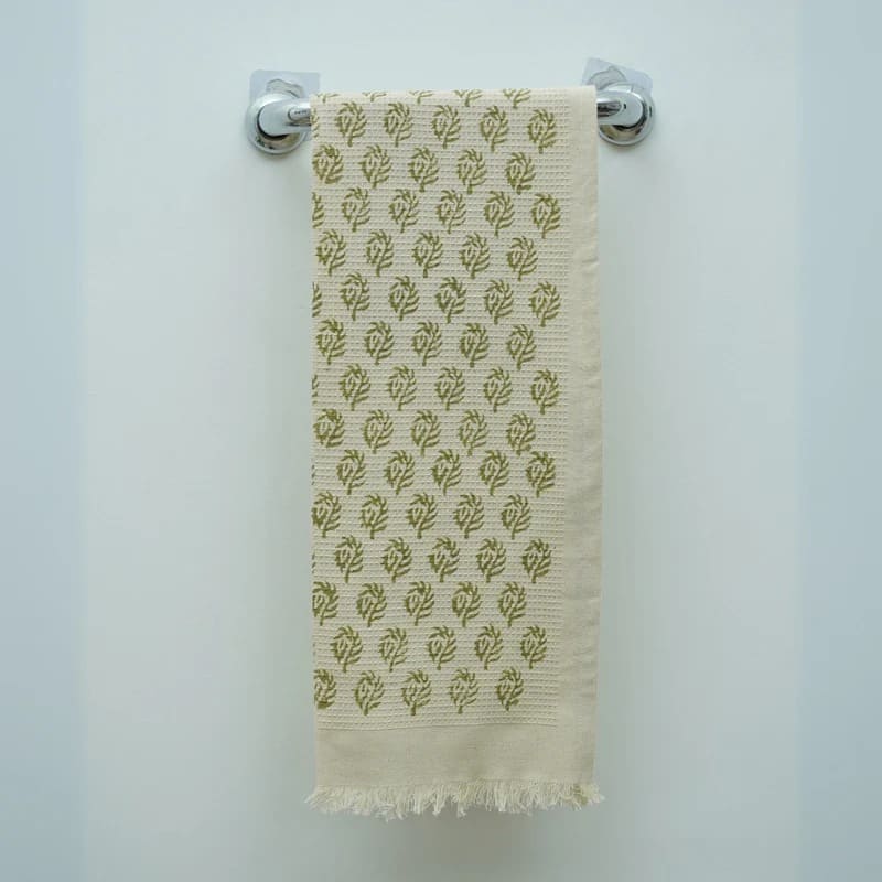 Green hand towel with subtle waffle texture