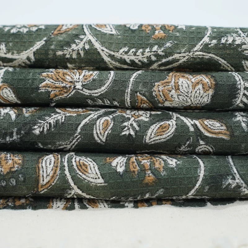 Green waffle weave towel with modern texture design