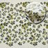 Printed tea towel in green with geometric accents
