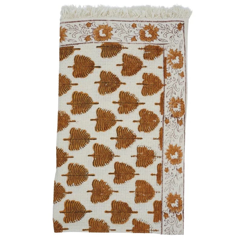 Block print green towel with detailed artwork