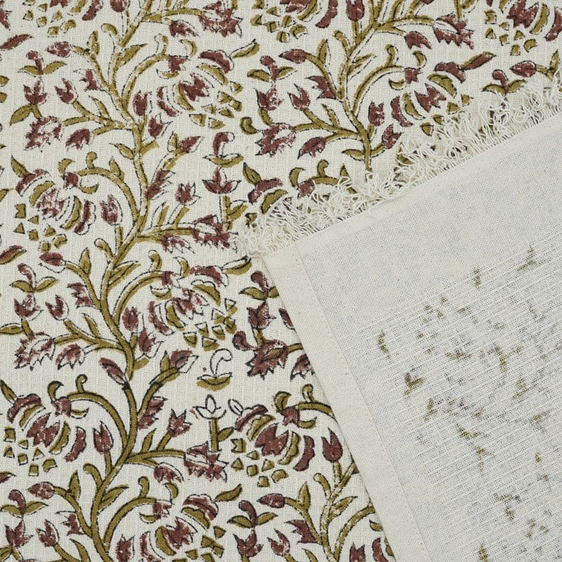 Green patterned towel draped over sink