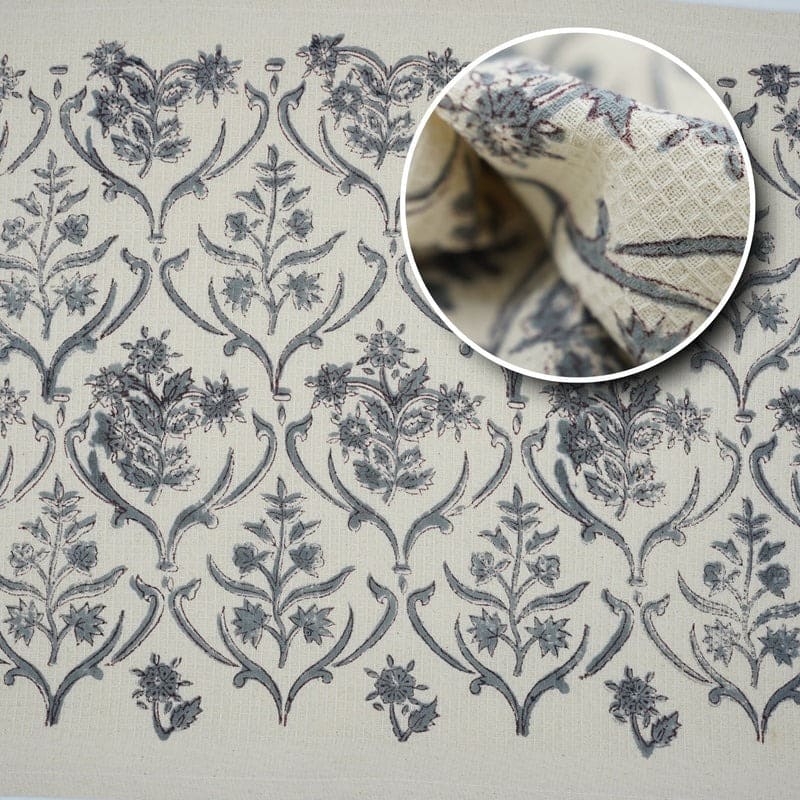 Printed towel with repeating green shapes