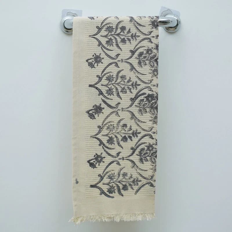 Ruffled cotton towel adding charm to kitchen