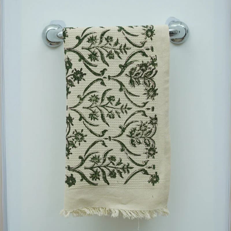 Decorative tea towel with elegant green design