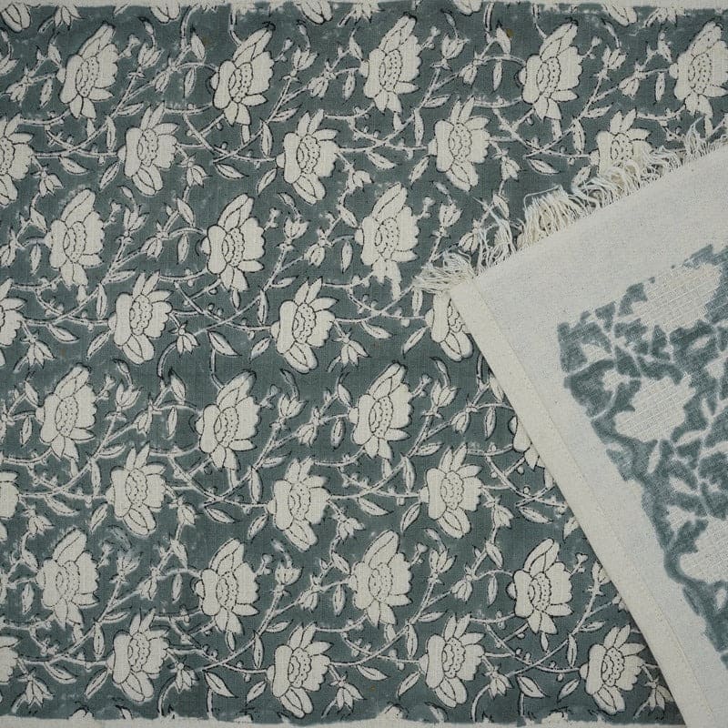 Decorative towel with green woven pattern