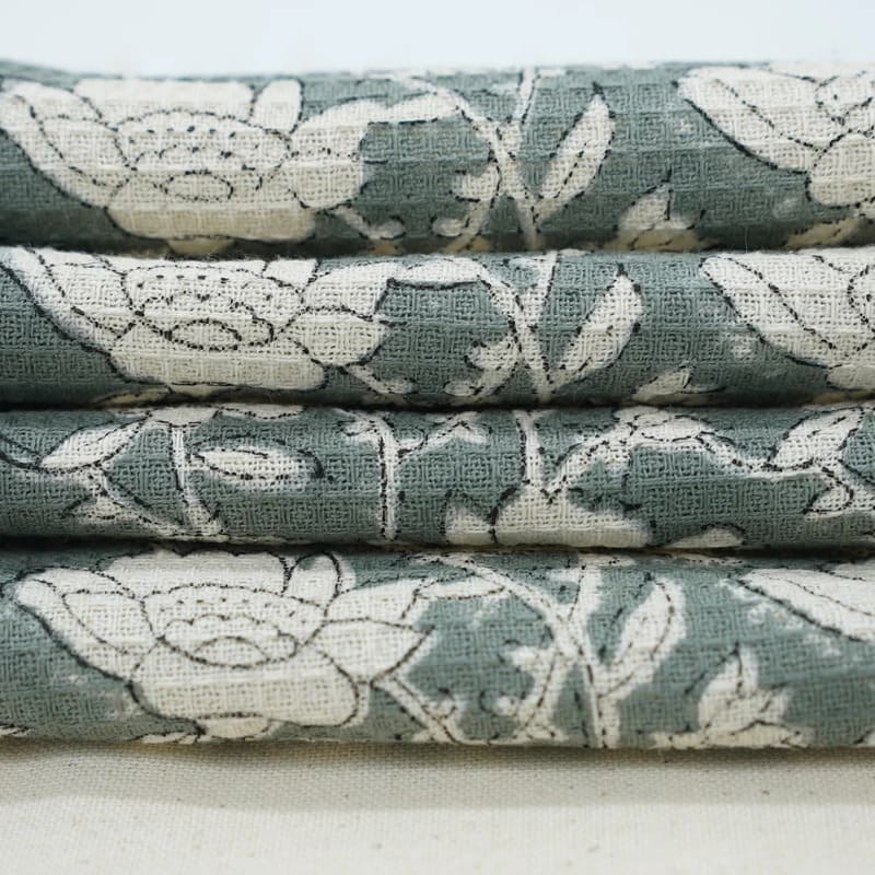 Green bathroom towel with cotton texture