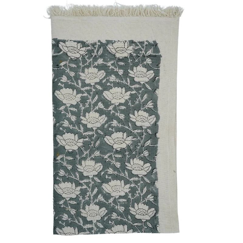 Hand towel green patterned folded neatly
