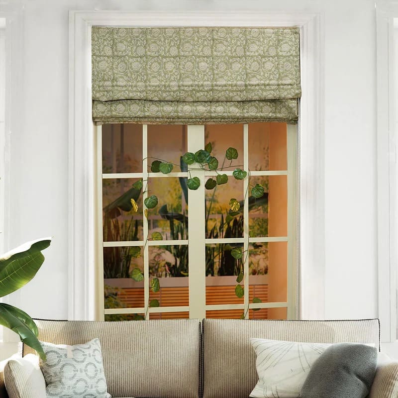 Windows styled beautifully with roman shades