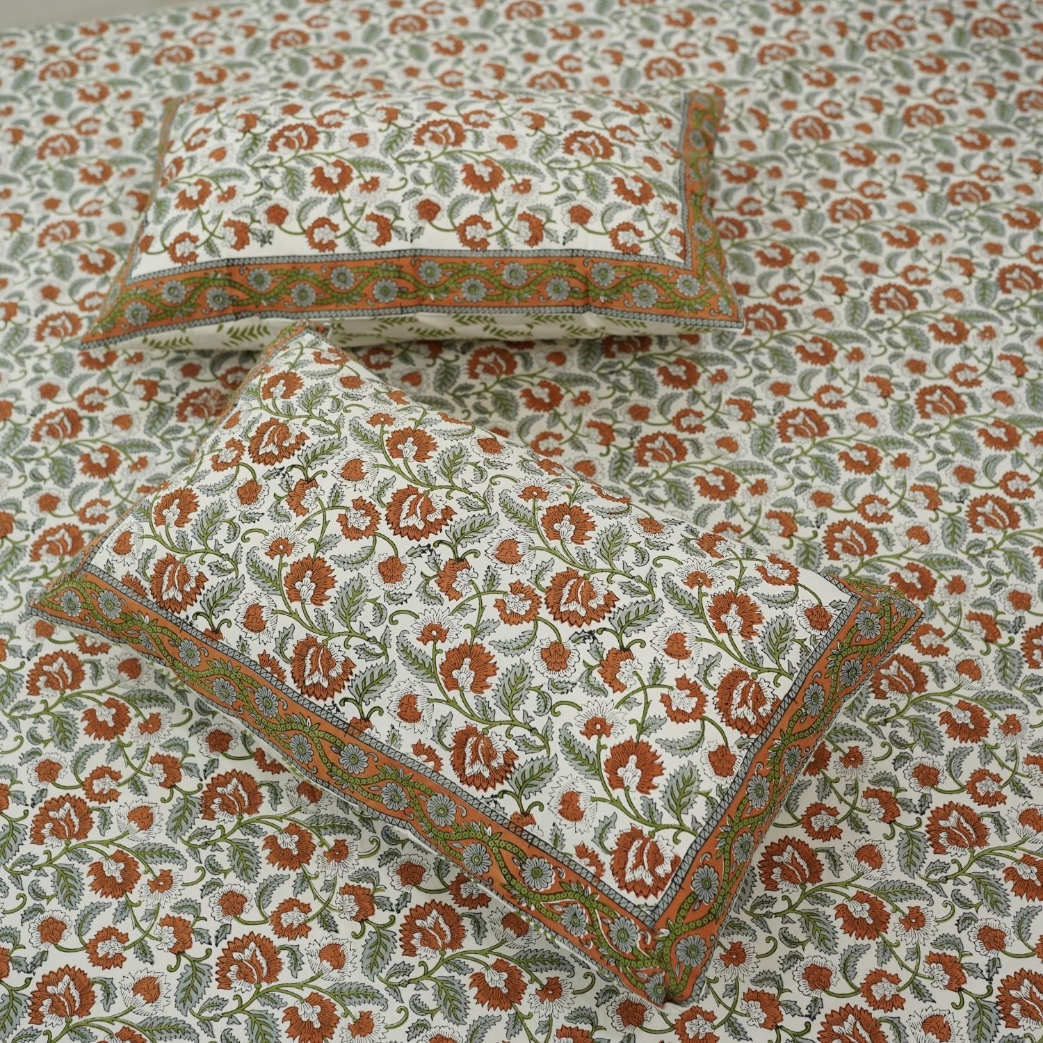 Indulge in the softness of pure cotton with our floral hand block printed bedsheet. The set, complete with pillow covers, combines traditional technique and modern comfort, ideal for a cozy, elegant bedroom retreat.