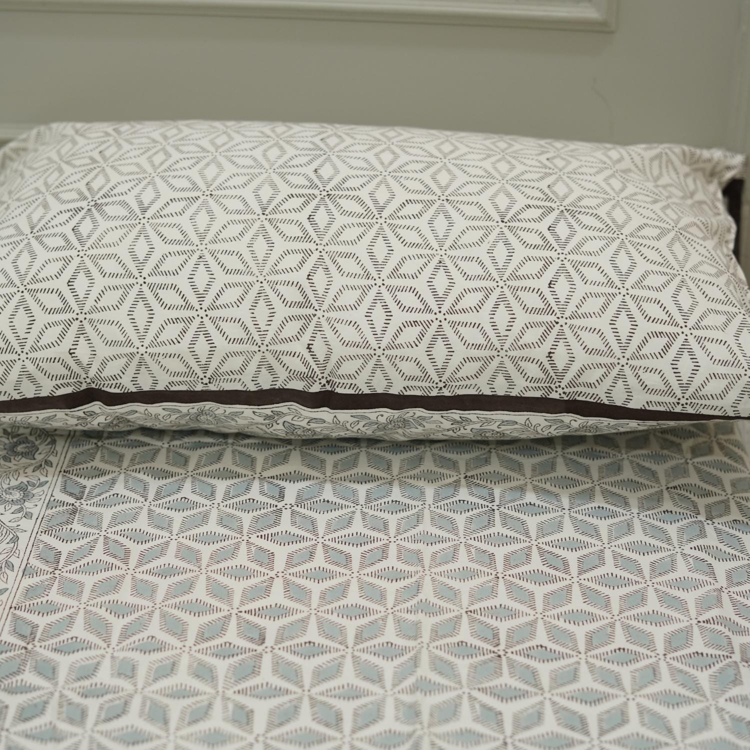 Hand block printed cotton bedsheet with floral design and matching pillow covers

