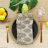 Floral block print frill napkin on a beautifully set table.
