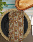 Table set with block print frill napkin featuring elephant design.