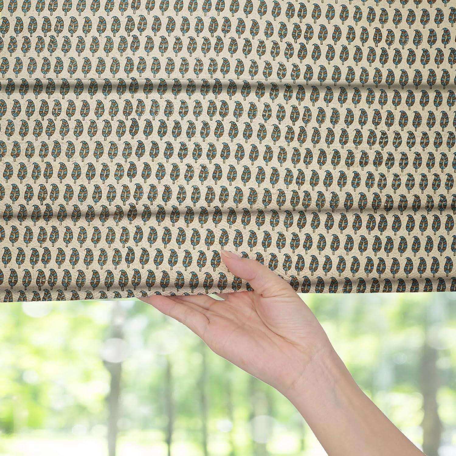 Linen blackout roman shade with floral motifs, perfect for keeping rooms cool and stylish. The cord system allows easy use and a clean finish.