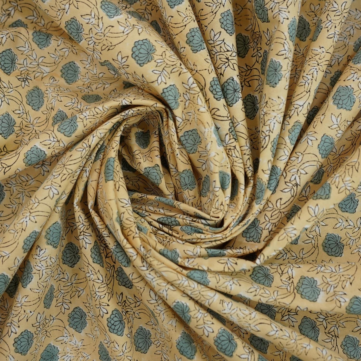 Let your bedroom bloom with handcrafted beauty. This hand block printed bedsheet on pure cotton, paired with pillow covers, captures floral artistry in soft tones. Each piece echoes heritage and the skill of artisans.