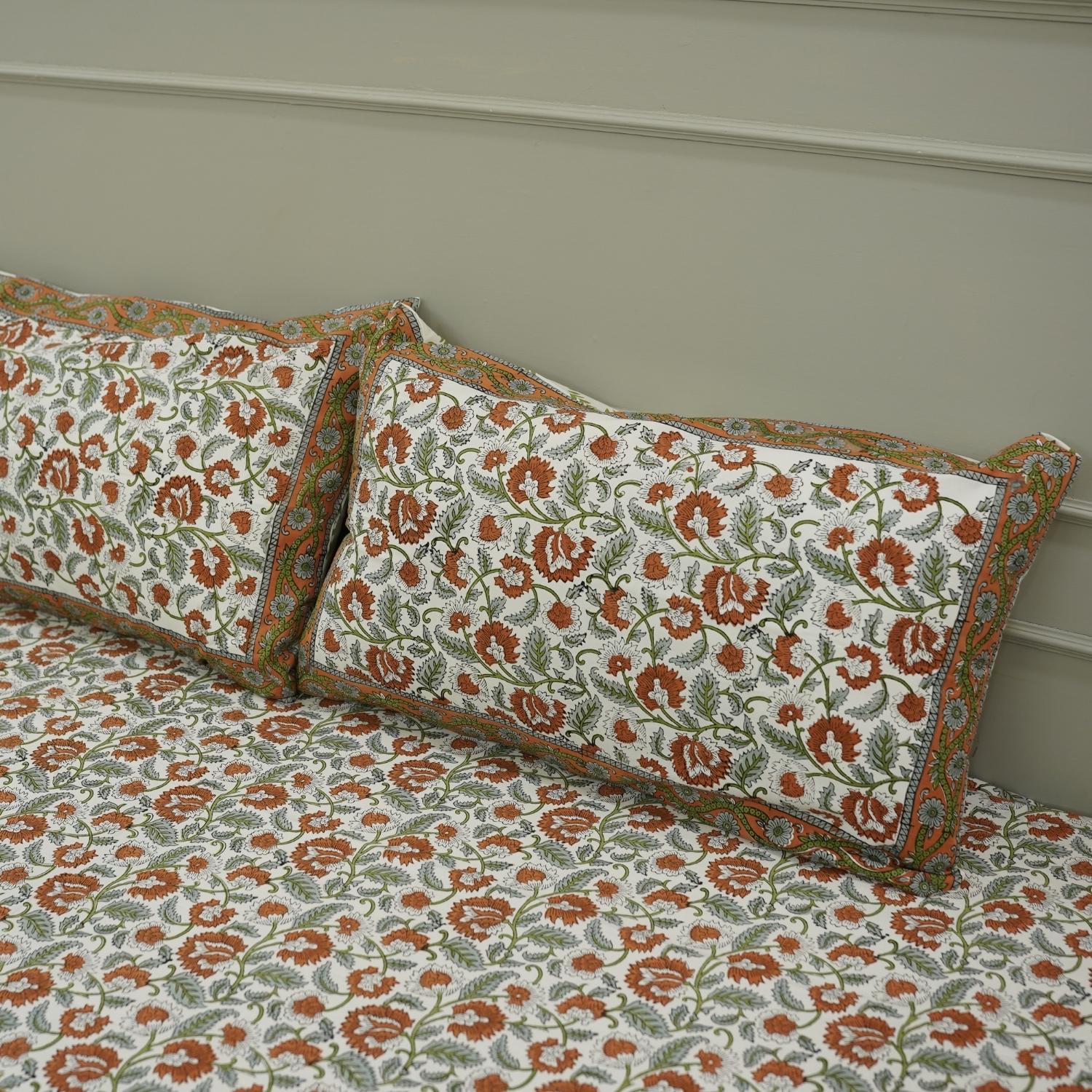 Our hand block printed cotton bedding set offers a unique floral design that celebrates heritage craftsmanship. Each detail is pressed by hand on soft cotton, creating a cozy, decorative accent for your bedroom.