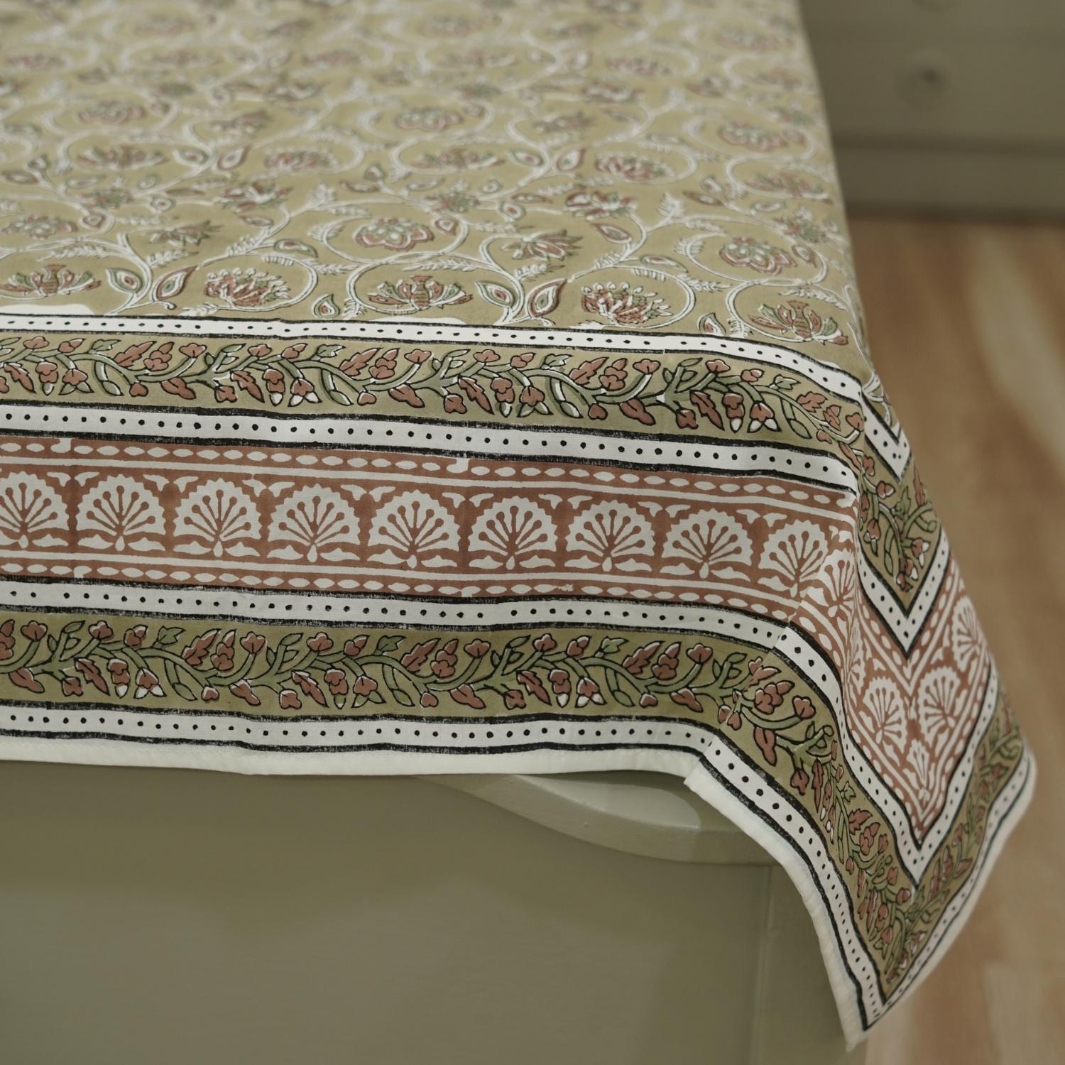 Decorative bedsheet with intricate block print patterns.